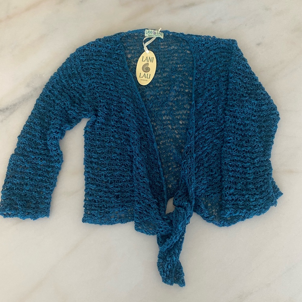 NWT loose knit cardigan. Can be worn open or knitted. One size.
